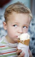 Boy eating ice cream photo