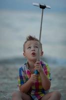 Boy holding a selfie stick photo