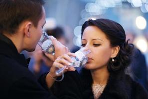 Couple toasting each other with champagne photo