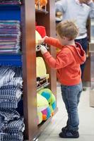 Boy shopping for beach accessories photo