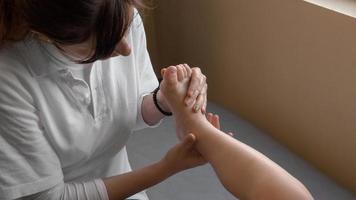 Beautician massaging a foot photo