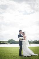 Pretty bride and handsome groom gorgeous posting in the nature photo