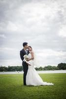 Pretty bride and handsome groom gorgeous posting in the nature photo