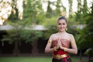 Beautiful woman wearing a typical Thai dress photo