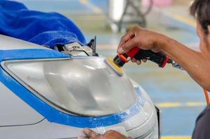 Polishing car headlights photo