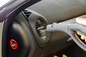 Cleaning the air conditioner of a car photo