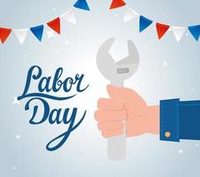 Happy labor day holiday celebration banner with hand holding a wrench vector