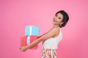 Beautiful happy woman with surprise gift boxes photo