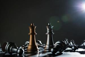 King and knight of chess setup on dark background photo