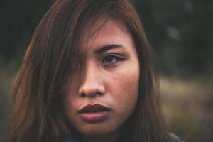 Portrait of a young beautiful woman at sunset photo