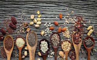 Grains in wooden spoons photo