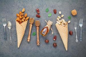 Nuts and honey with utensils photo