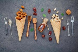 Honey and nuts with utensils photo