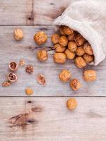 Walnuts kernels in hemp sack photo