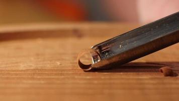 Woodcarver cuts mahogany with a chisel macro. Contains sound ASMR video