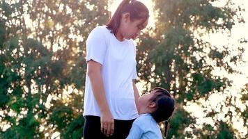 Mother comforting her crying little girl in an outdoor park. video