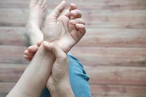 Young woman's hands suffering wrist pain photo