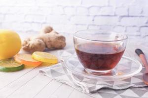 Top view of ginger tea on wooden background photo