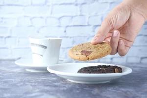 Close-up of cookies and tea on table photo