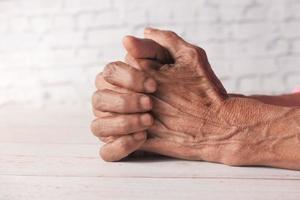 Close-up of hands of an elderly person isolated on white background photo