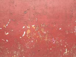 Red wall with old paint peeling photo