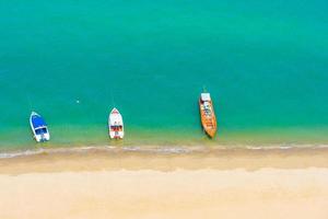 Boats on beautiful tropical sea at the beach photo