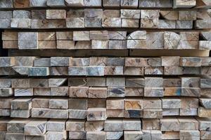 Cut lumber for sale stacked in the lumberyard photo