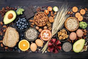 Top view of healthy foods on a dark slate background photo