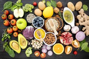 Top view of healthy foods on a dark background photo
