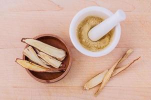 Licorice herbal medicine on wood photo