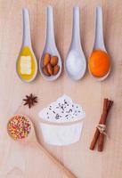 Cupcake ingredients on wood photo