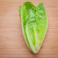 Lettuce leaves on wood photo