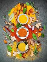 Colorful spices on a gray background photo