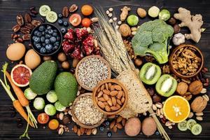 Top view of healthy foods on a black background photo