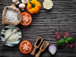 Pizza ingredients in an arc photo