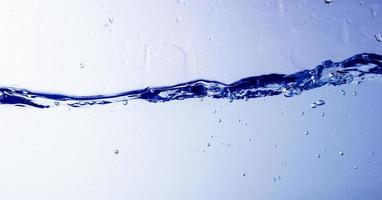 Water and bubbles on blue background photo