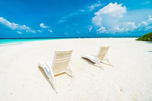 Sunbathing beds on the beach photo