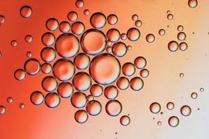 Close-up of water drops on orange surface photo