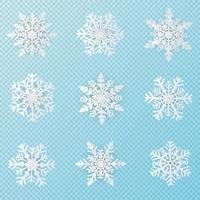 conjunto de 9 arte de papel de copos de nieve de navidad blanca vector