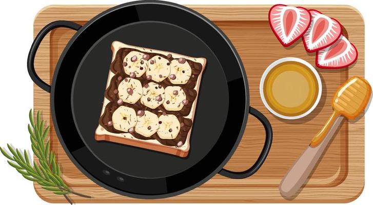 Breakfast set in the pan with cutting board