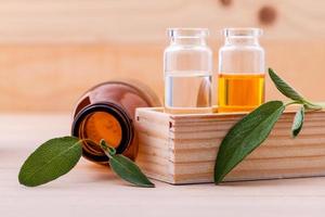 Sage essential oil on wood