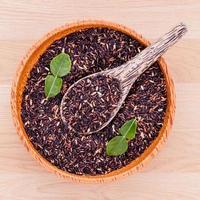 Berry rice in a bowl with a spoon photo