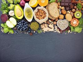 Healthy foods with copy space on dark slate photo