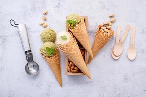 Pistachio and vanilla ice cream in cones photo