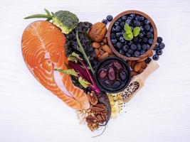 Salmon and fresh ingredients in a heart shape photo