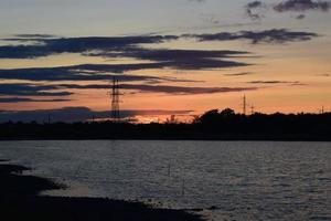 Sunset over a lake during summer photo