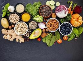 Top view of healthy foods on dark slate photo