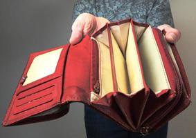 A woman holding an empty money purse photo