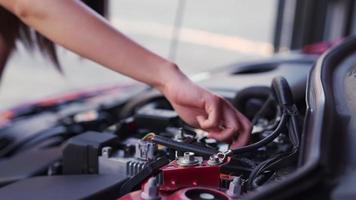 Woman Checks the Engine of a Car video