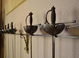 Swords hanging on the wall for display photo